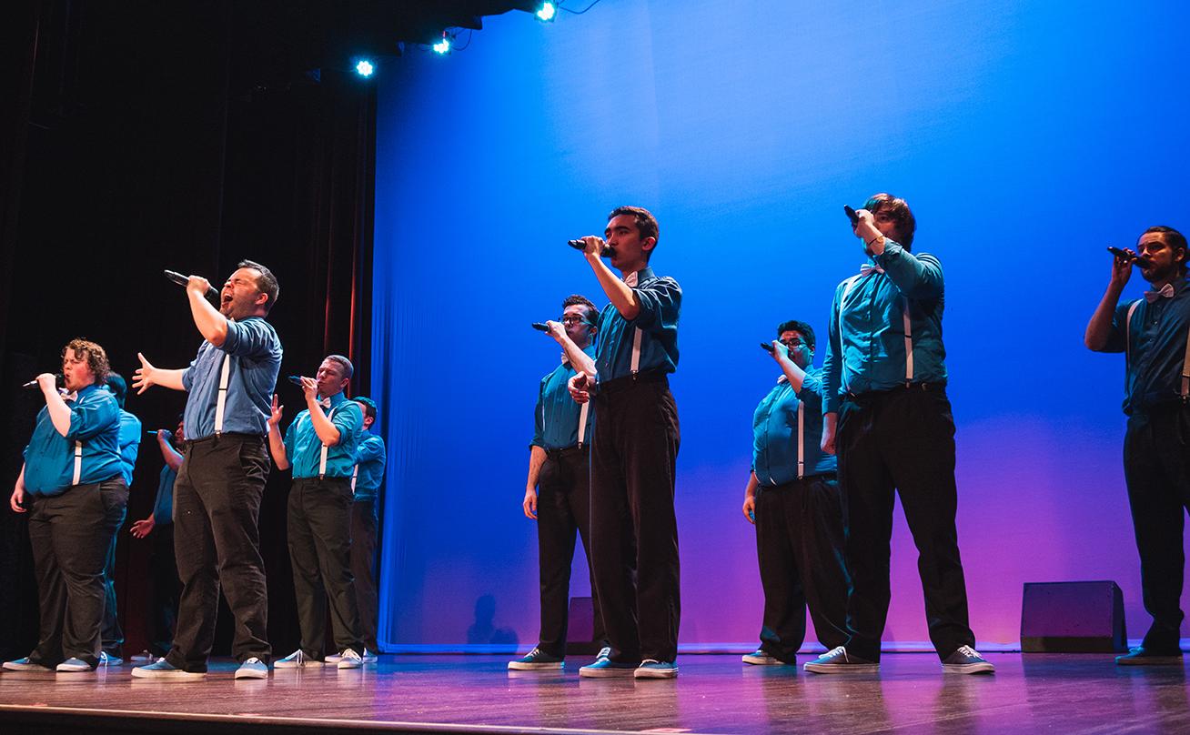 Mens Group Singing on Stage