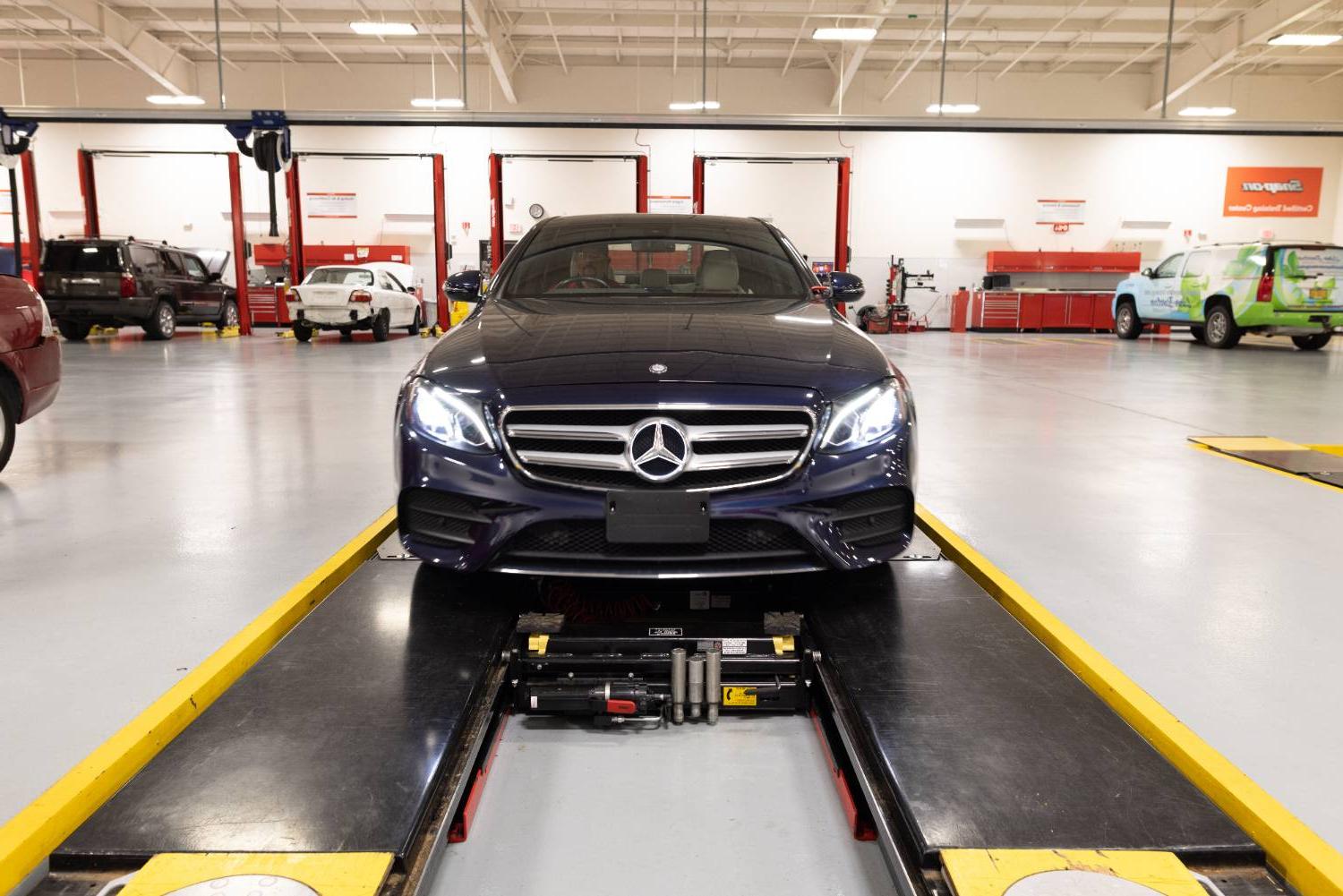 photo of a car ready to be lifted